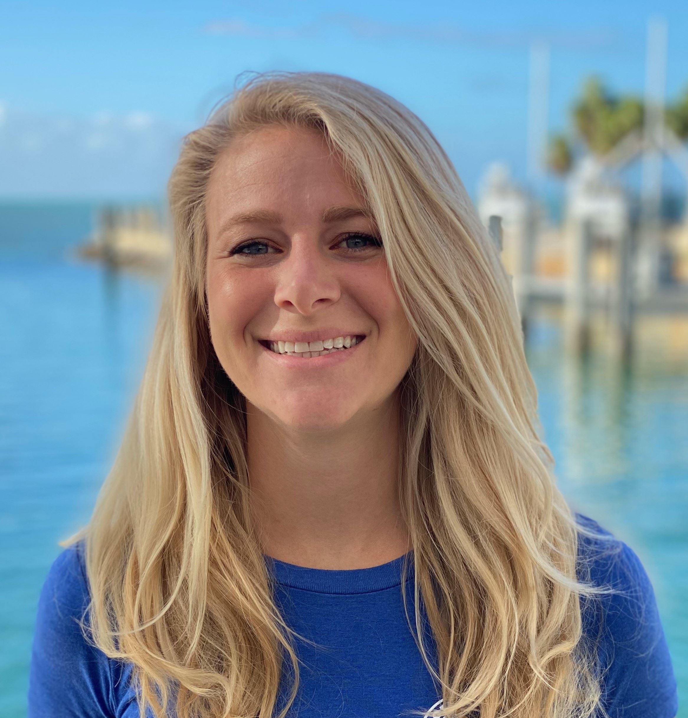 Hanna Koch Headshot with a water background behind her